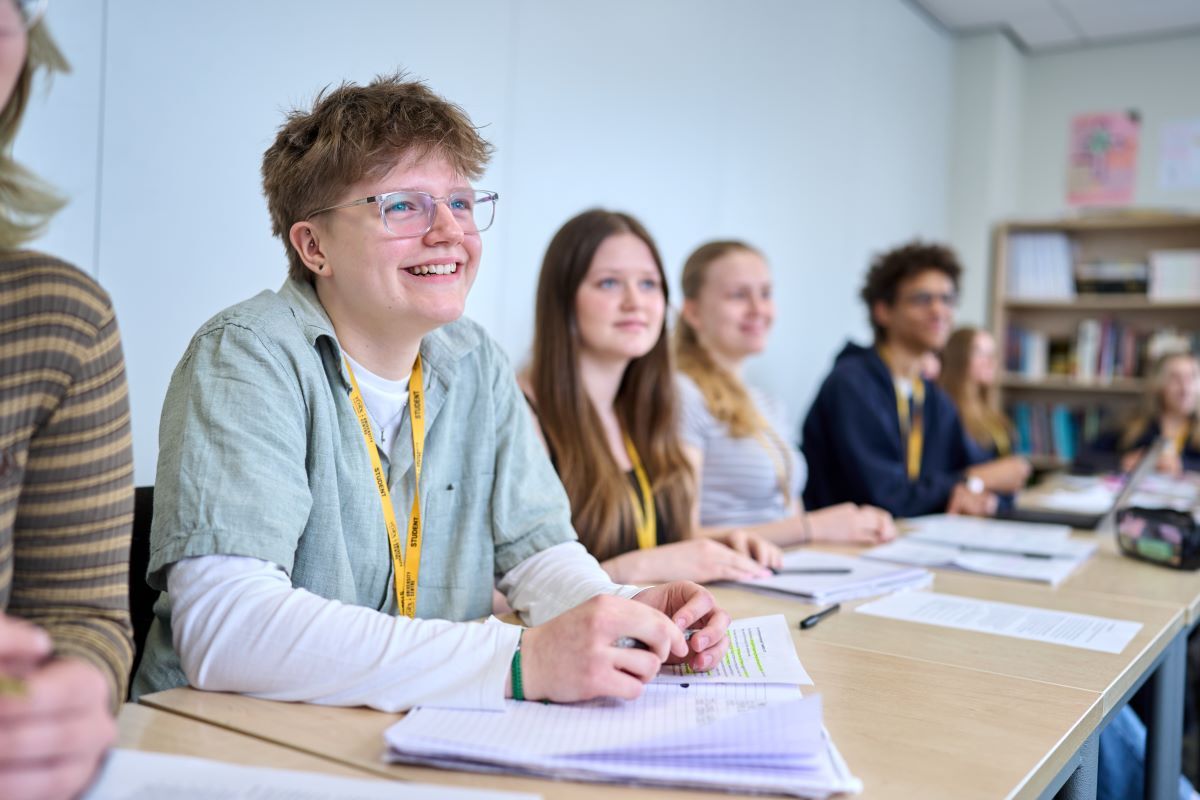 Humanities students smile as they complete their work - A Levels & Mix
