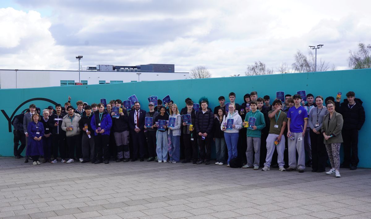 A group of students receiving their Brilliant Futures Pledge certificates