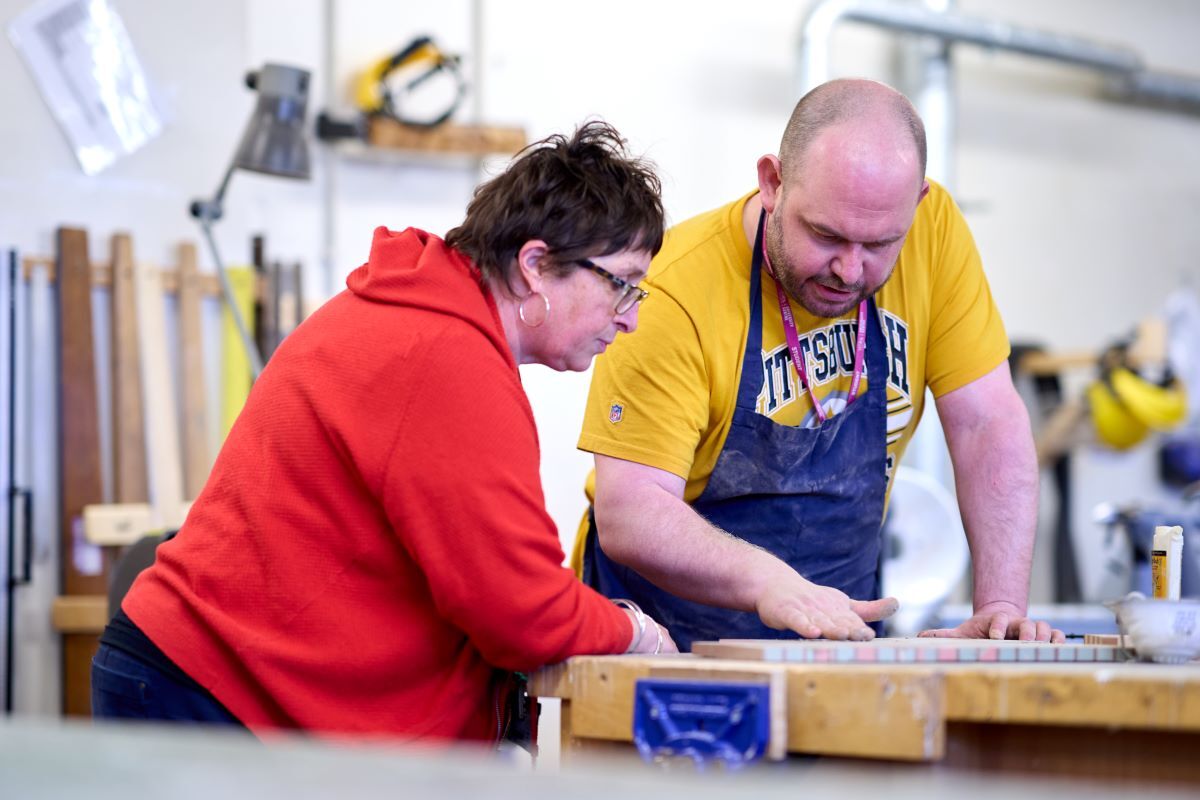 A student and a tutor work on some designs 3 D Creative Practice