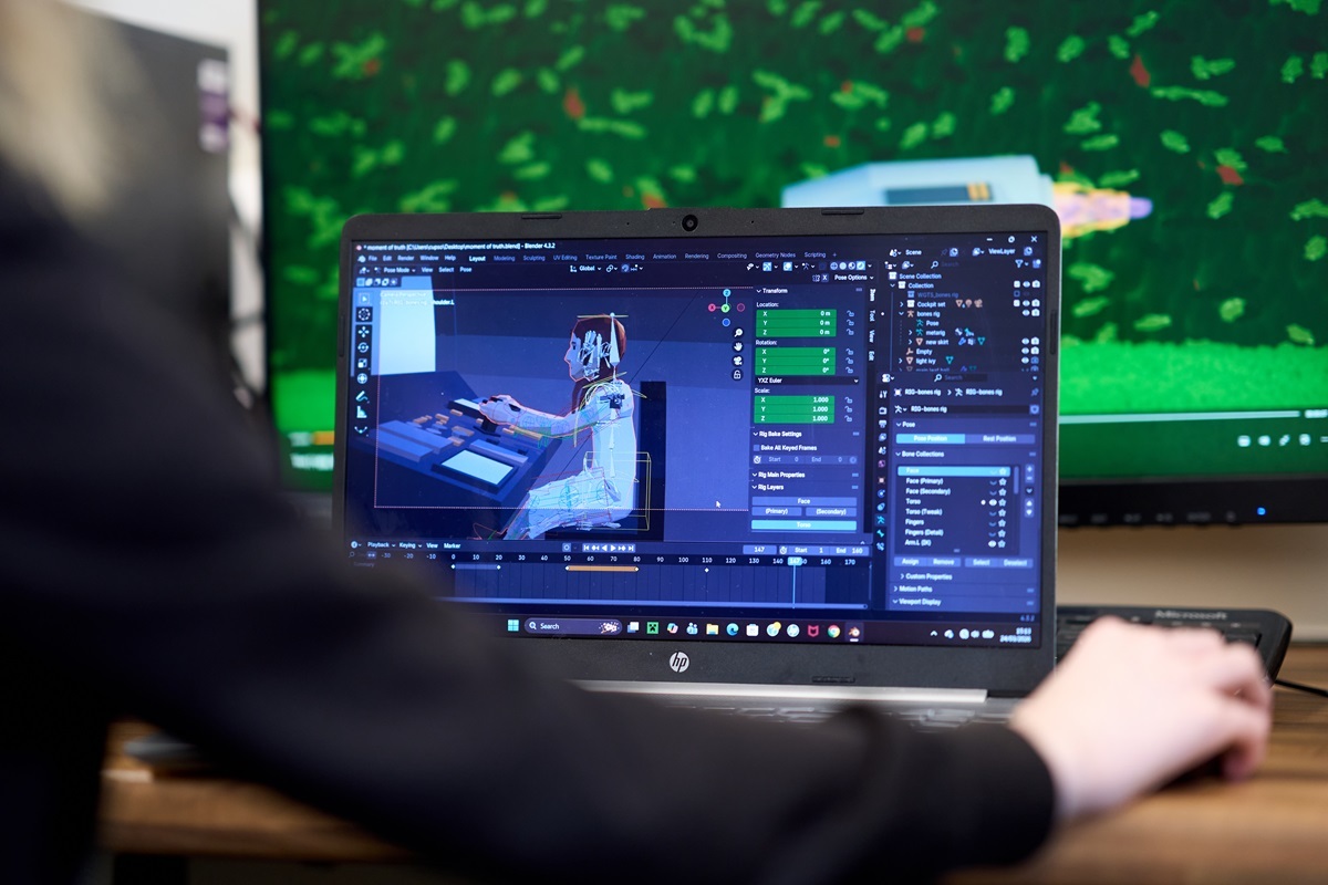 A student does some editing on a computer Film