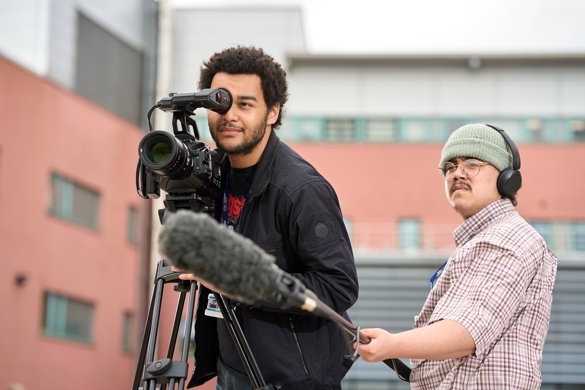 A student operates a camera and one holds a microphone York School of Art