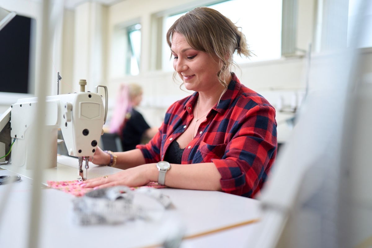 A student uses a sewing machine York School of Art