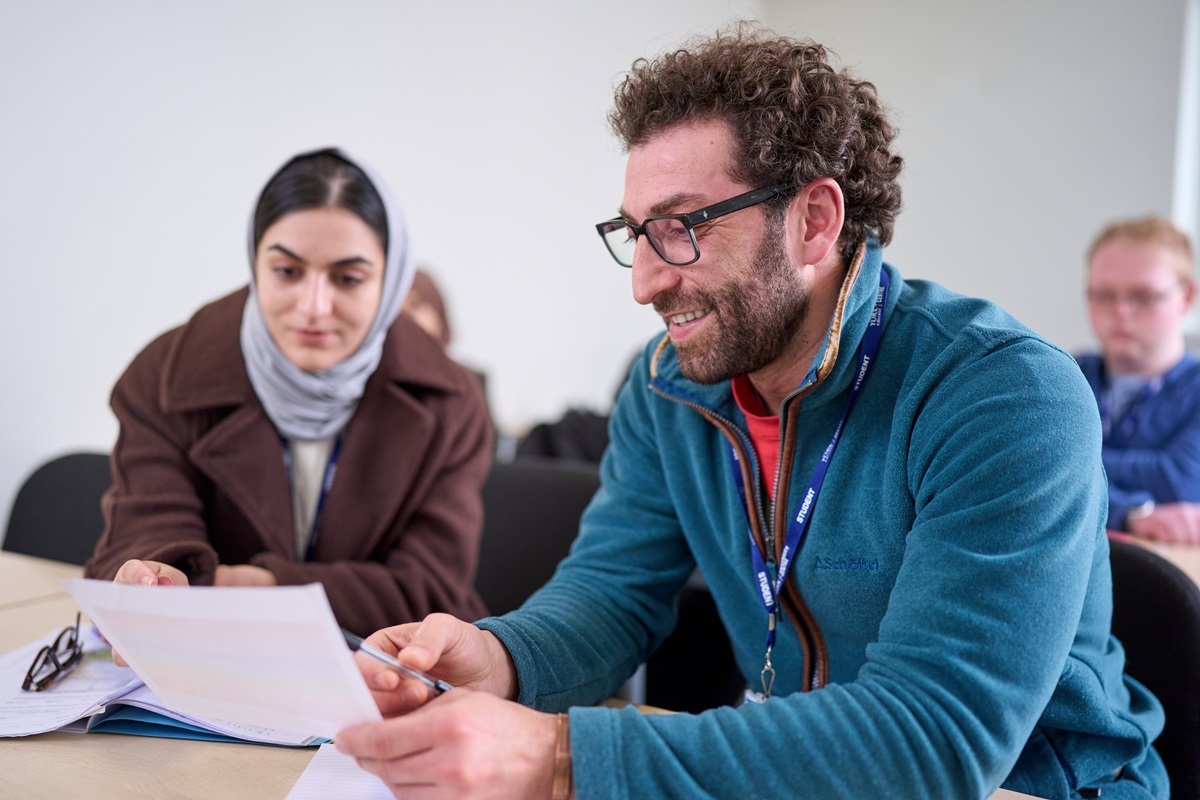 A student works out a maths problem Courses for Adults