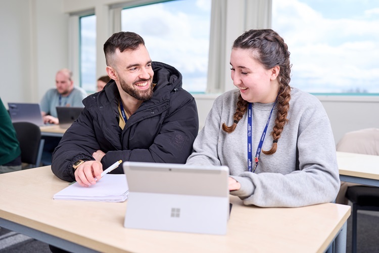 Access Health two students smile and work