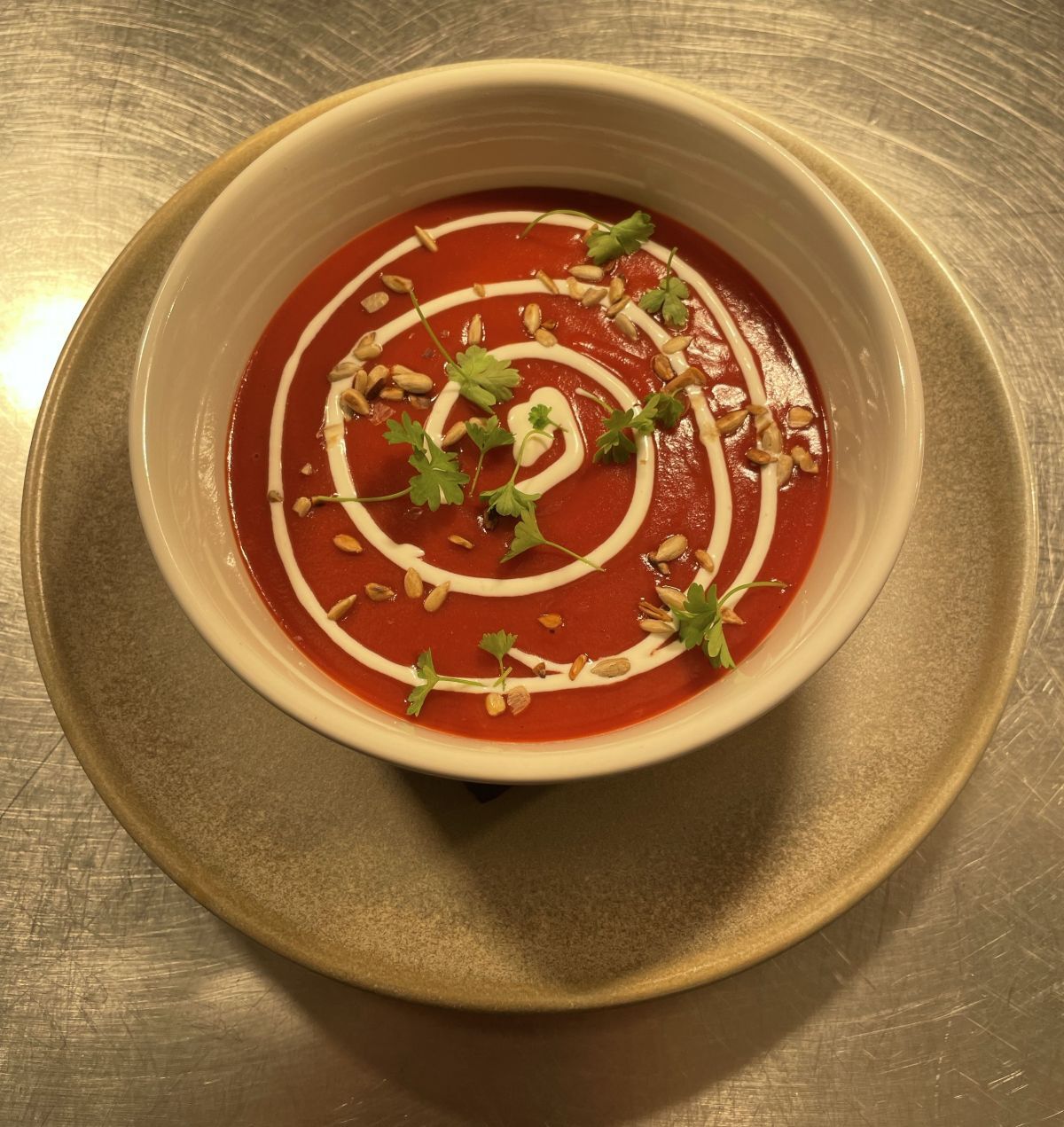 Bowl of tomato soup with swirl of cream