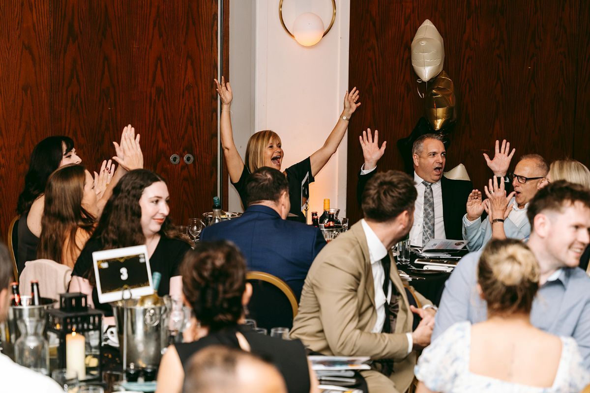 Brilliance Awards 2026 table of people celebrating