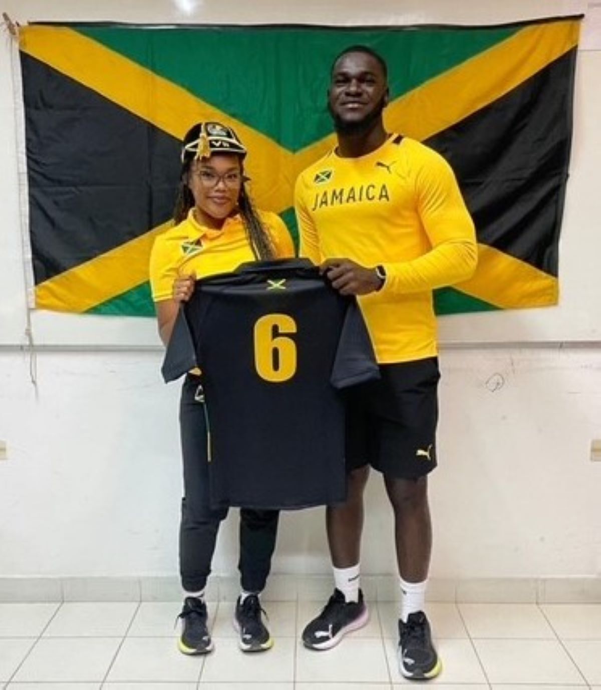 Chevelle is presented with her international shirt by Head Coach Tahj Jay Lynch
