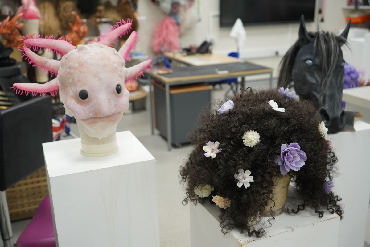 Close up shot of Abi Hortons axolotl mask wig and horses head on plinths