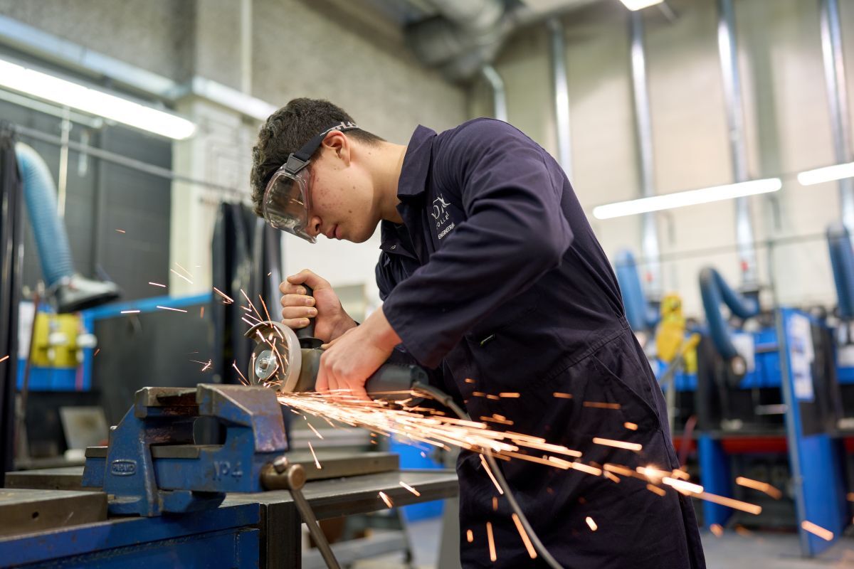 Engineering student working on a machine