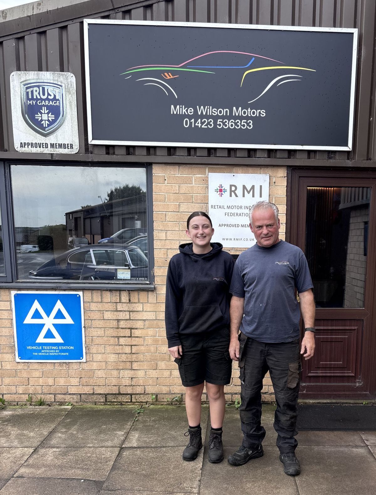 Georgina Richardson with her boss John Ellis pictured outside the Mike Wilson Motors office