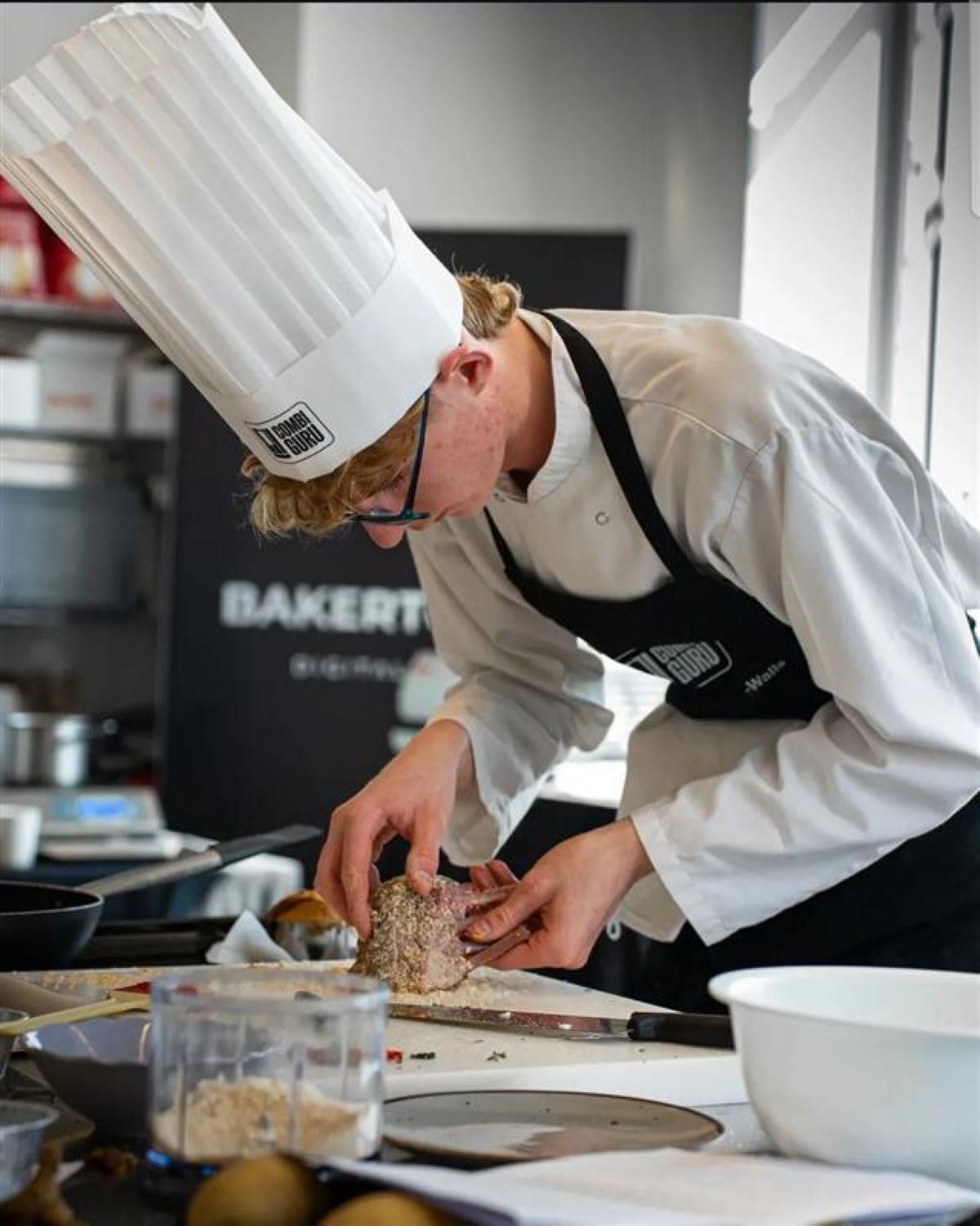 Hospitality student Hayden prepares his food during the competition in Venice