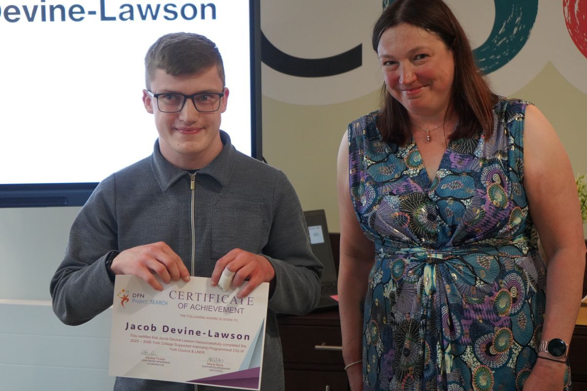 Jacob Devine Lawson receiving his Supported Internship certifcate from Rachel Fowler