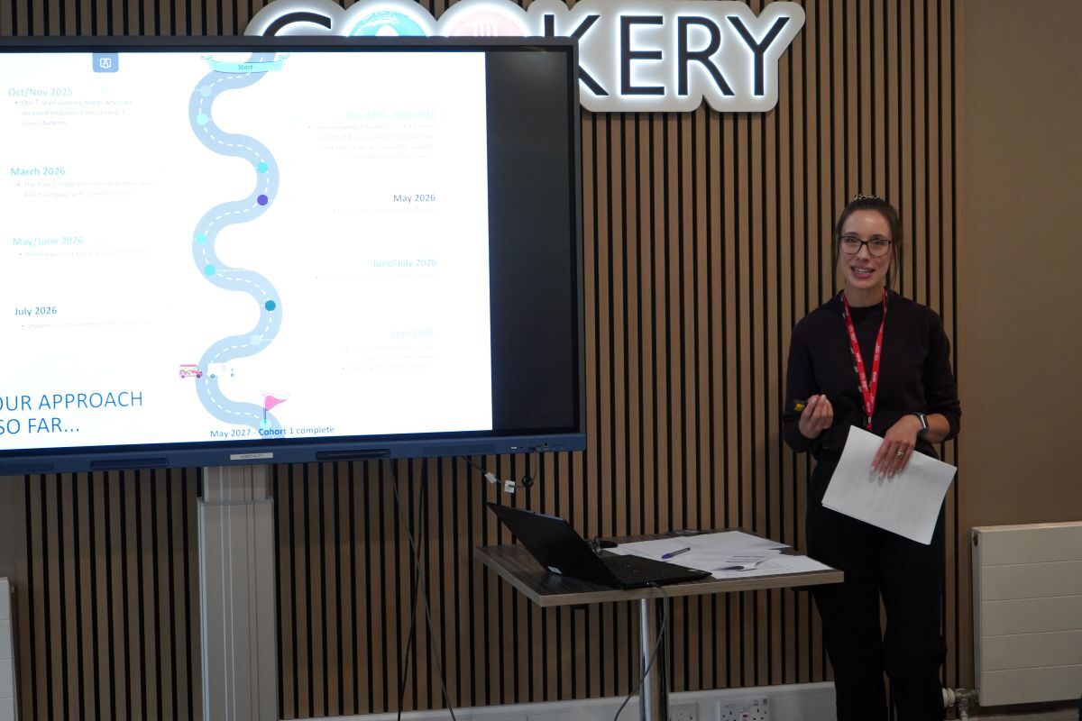 Katy Urakalo from Bettys Taylors addresses an audience in The Cookery restaurant at the side of a big screen