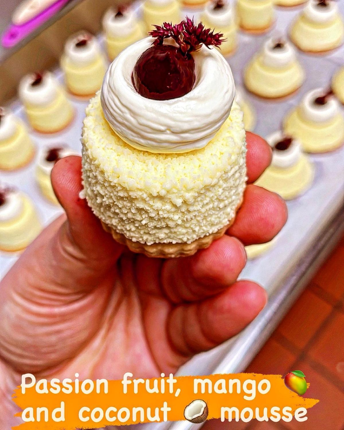 Passion fruit mango and coconut mousse being held by a woman