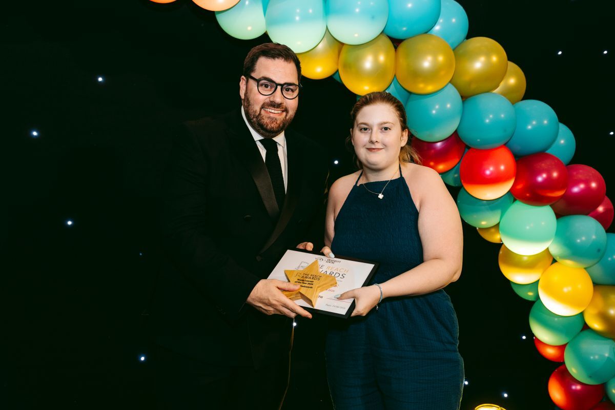 Poppy Wadsworth receives the REACH Young Learner of the Year award from York College University Centre Principal Chief Executive Ken Merry