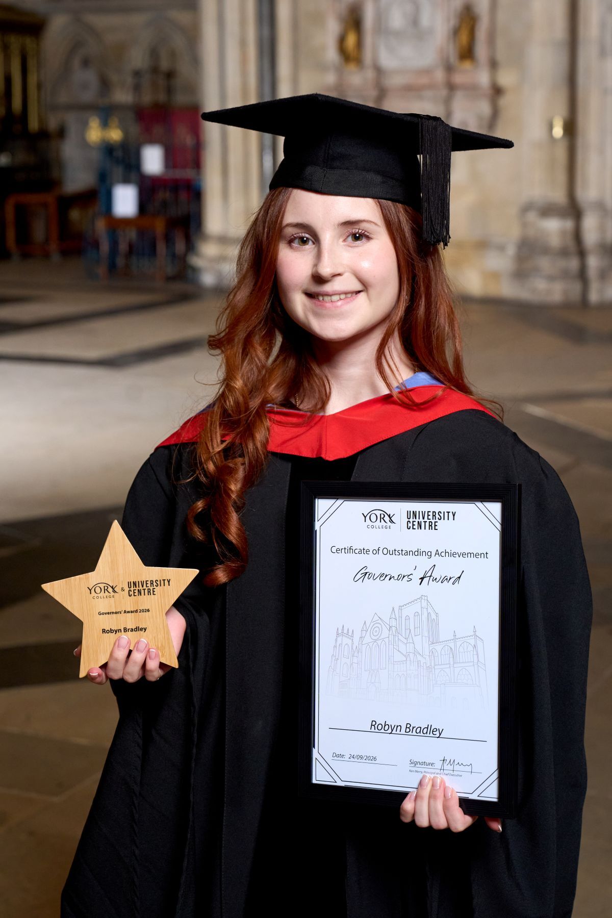 Robyn Bradley with her Graduation Governors star shaped award and certificate in York Minster