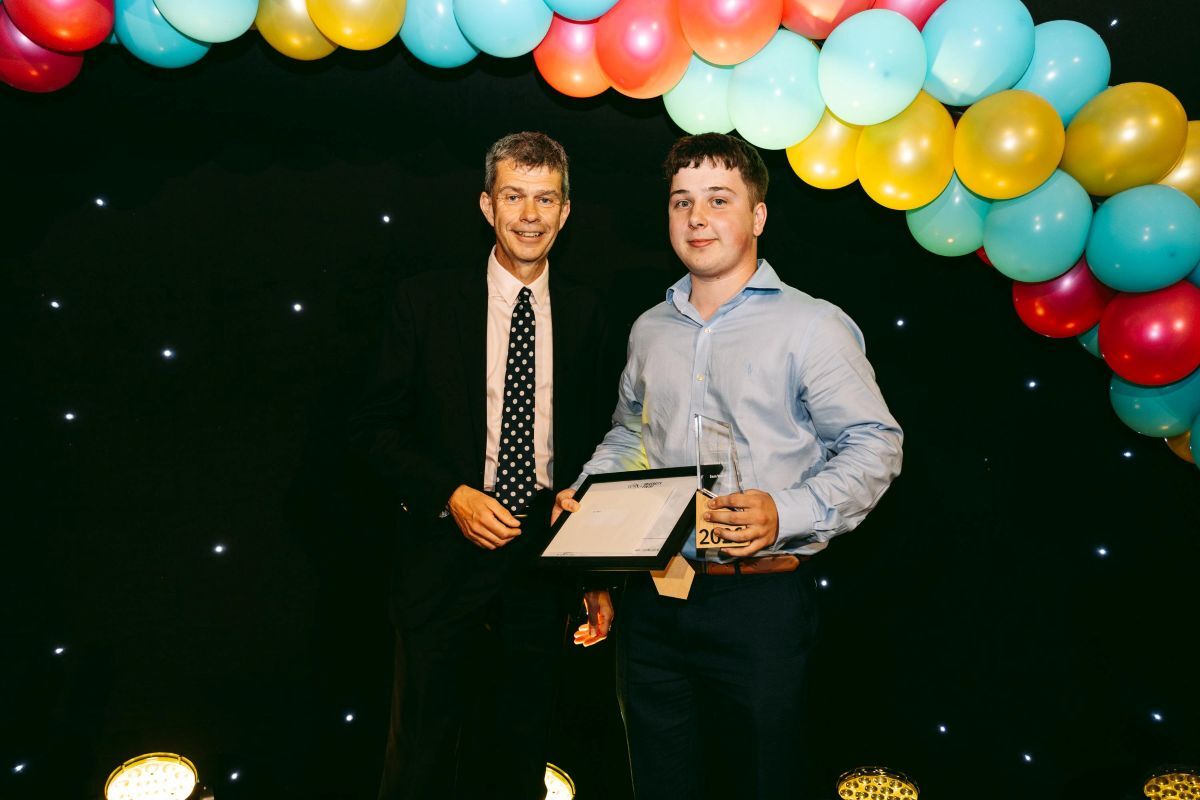 Sam Welch is presented with the REACH Governors Award by York College Chair of Governors Ian Looker