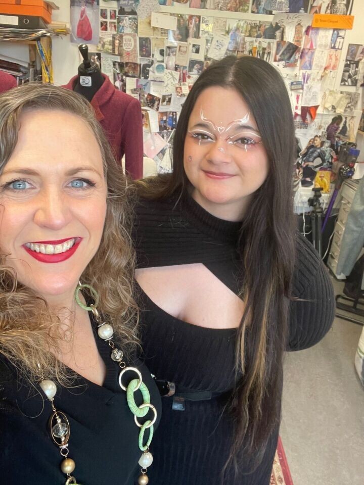 Student Mina with Isabelle Randal on work experience smiling to Camera