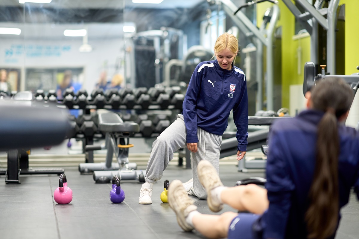 Students doing post match recovery exercises