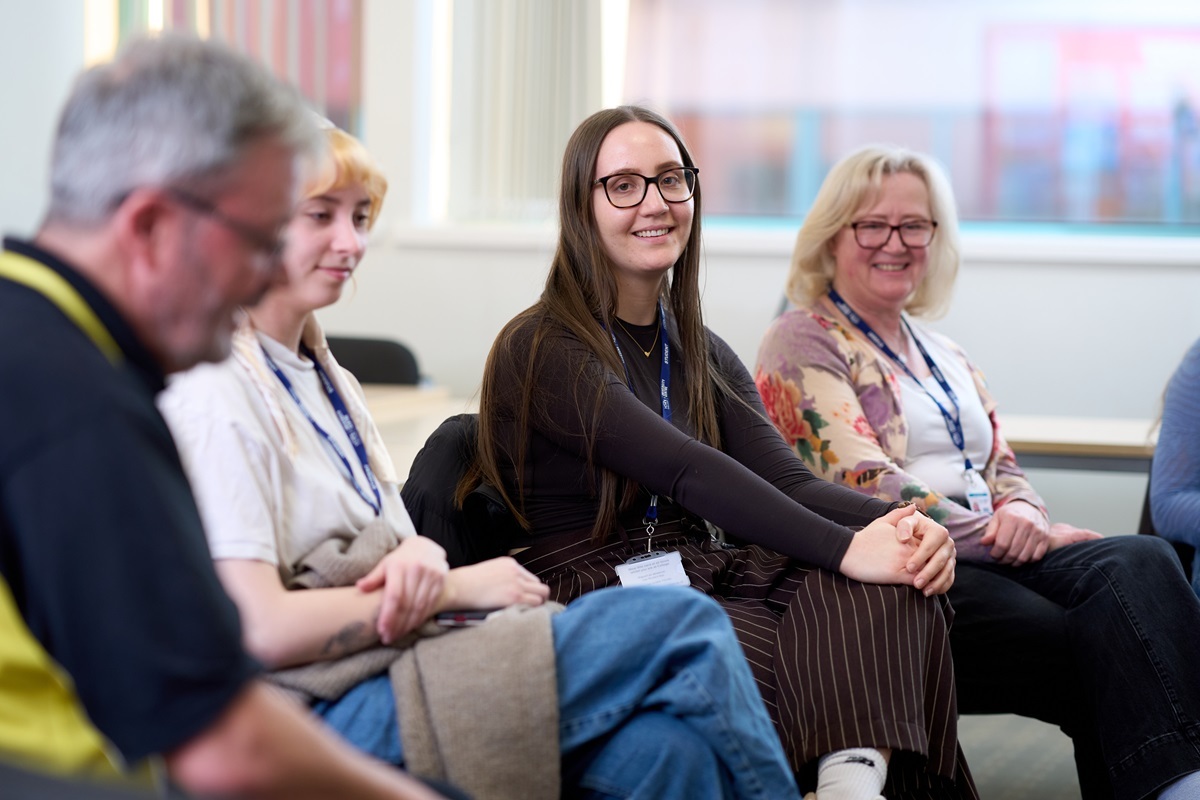 Students smile at a therapy dog Counselling