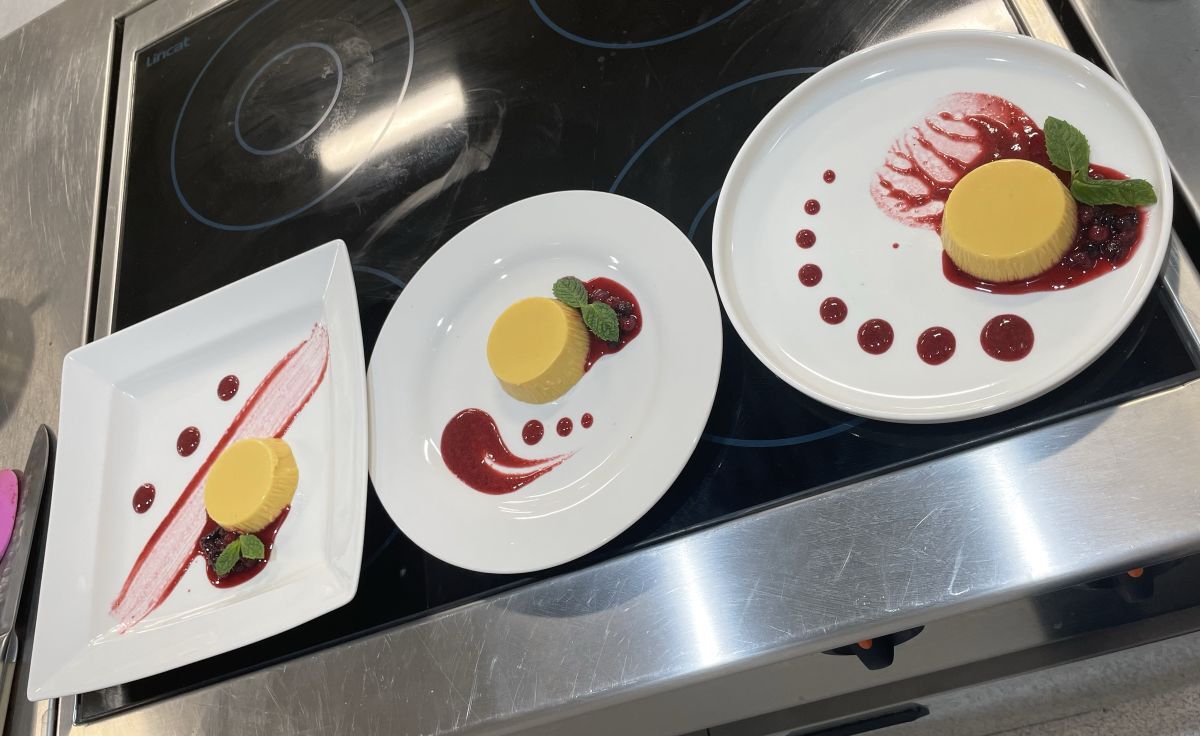 Three panna cottas with sauce decorated in different patterns