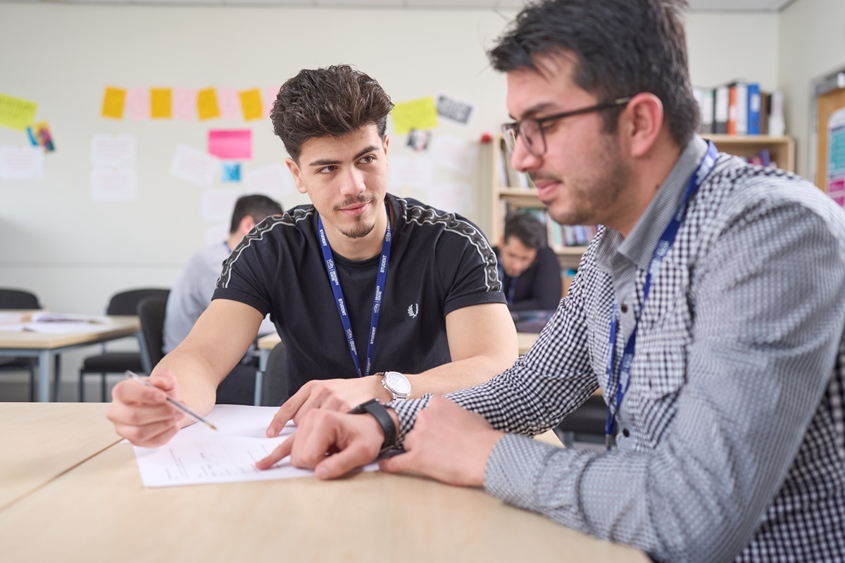 Two students go over their work GCSE English