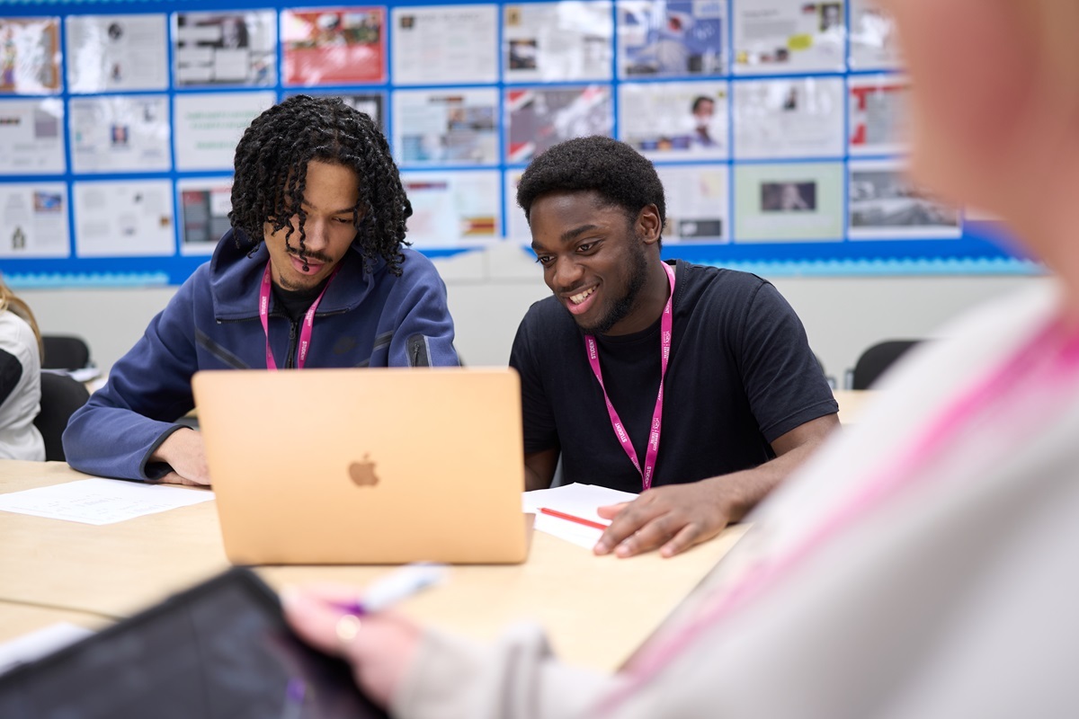 Two students look at a laptop CIPD