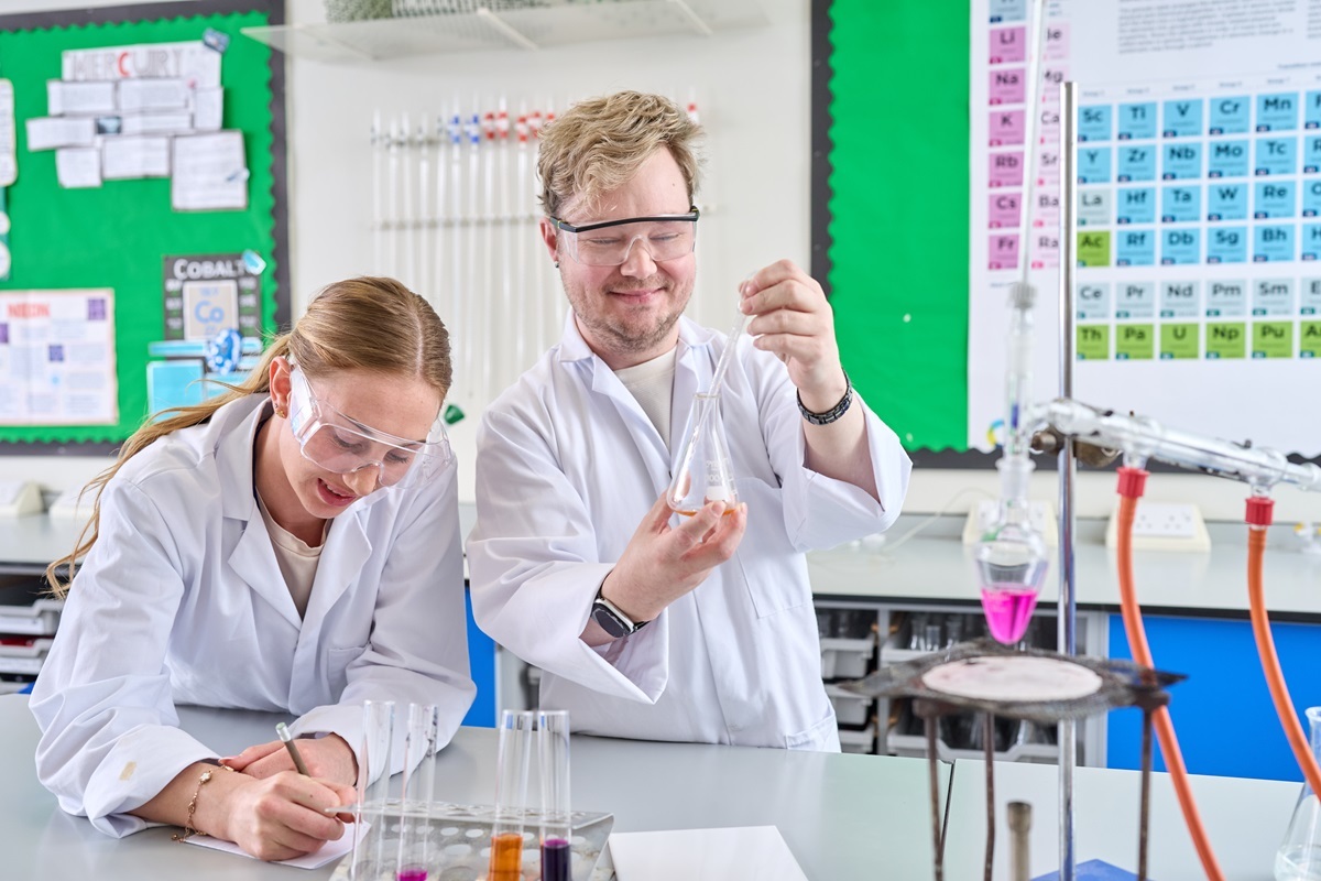 Two students undertake a chemistry experiment Access to HE