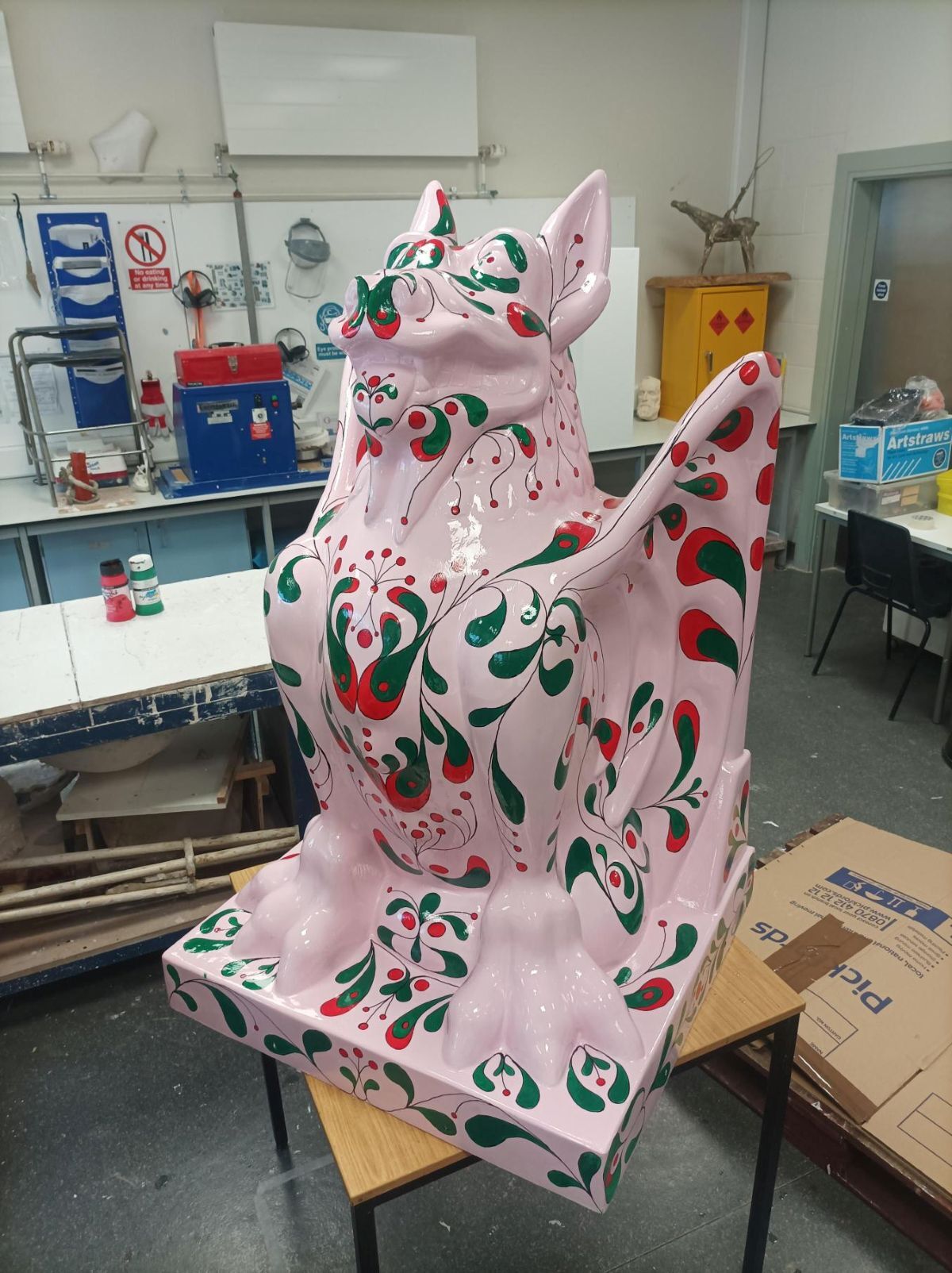 Varnished Watcher sculpture in College workshop front left view