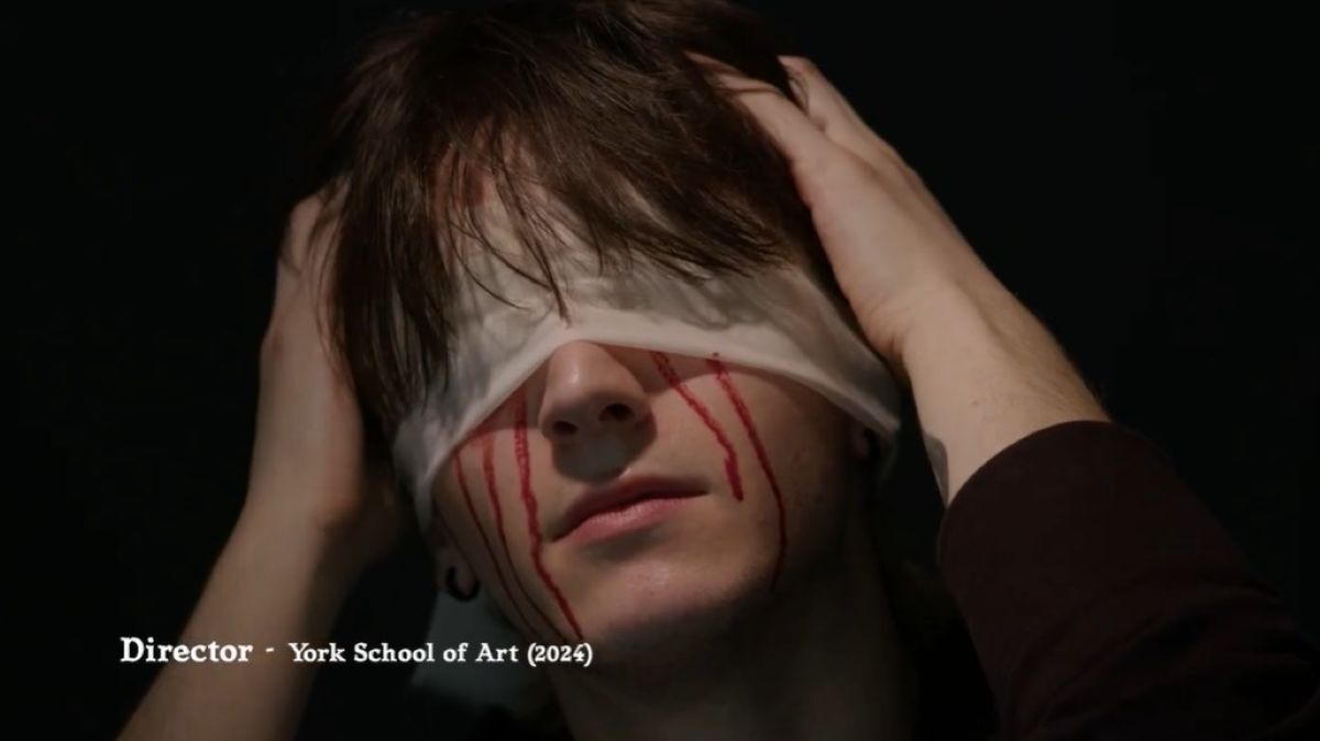 Woman with bandage over her eyes and blood pouring down her face from both eyes