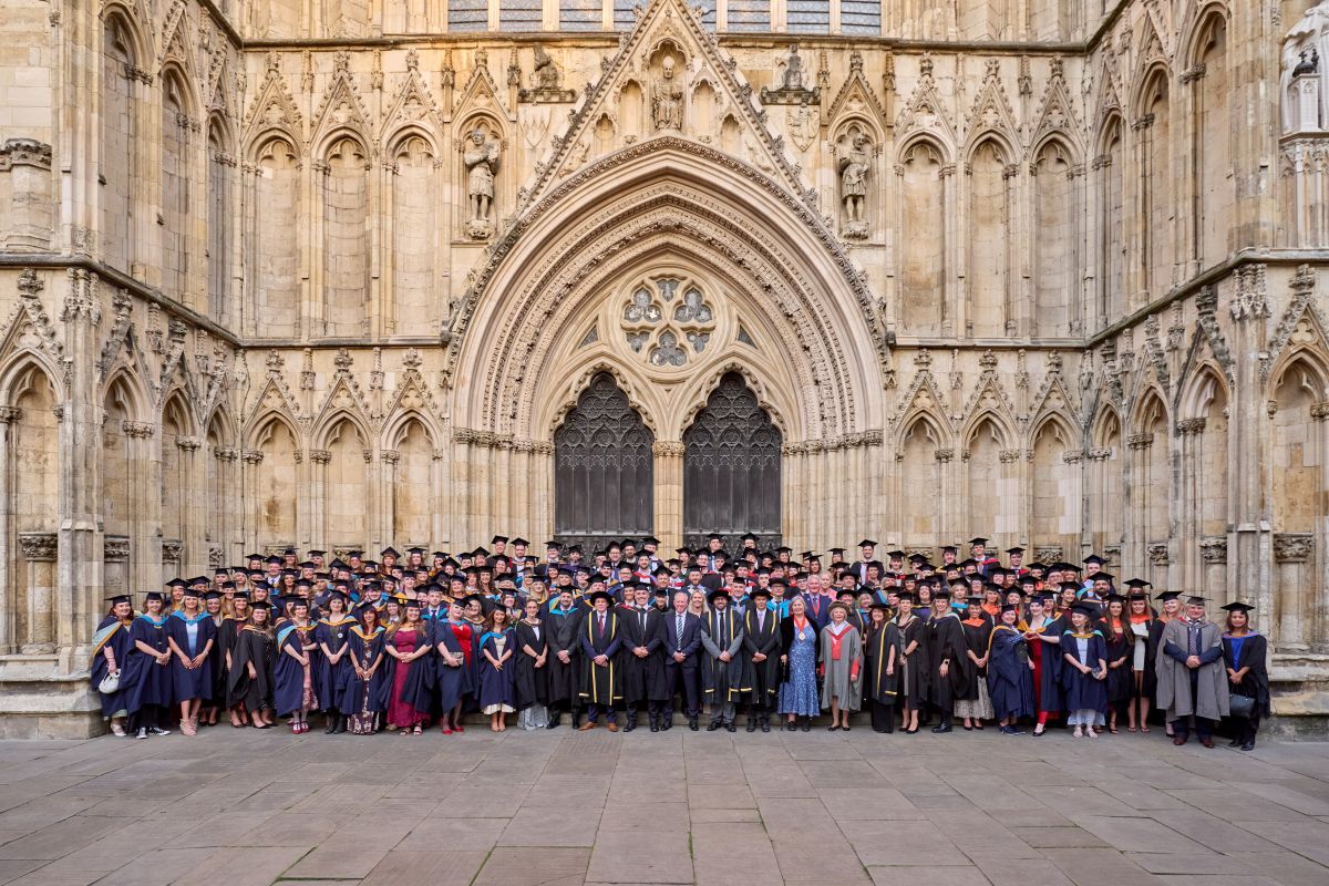 York College University Centre graduates outside York Minster with staff and VIP guests including former England football manager Steve Mc Claren