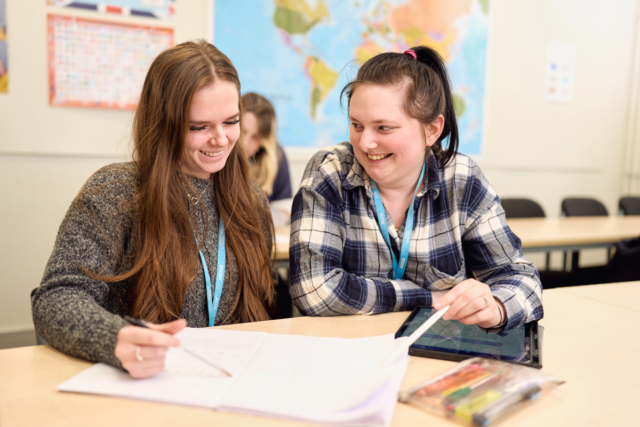 Two students make notes Access Health Science