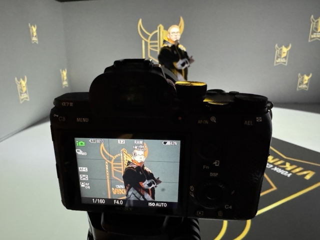 Student being photographed in the Immersive Room