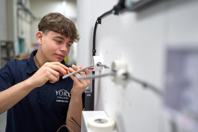 Electrical Installation student fitting some wiring