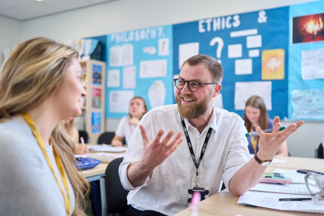 Philosophy tutor discussing the topic with a student