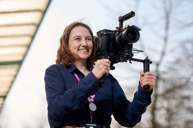 A Film student operates a film camera Film