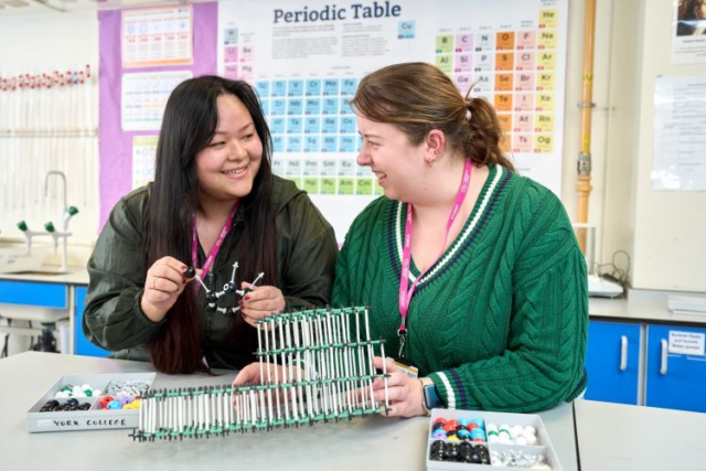 Two students make models representing DNA