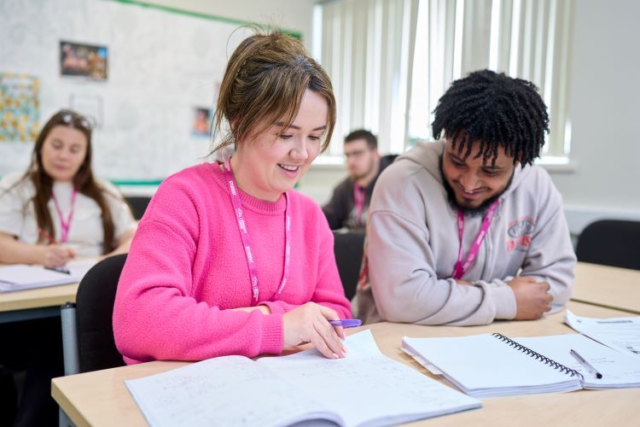 Two students work through some maths problems together