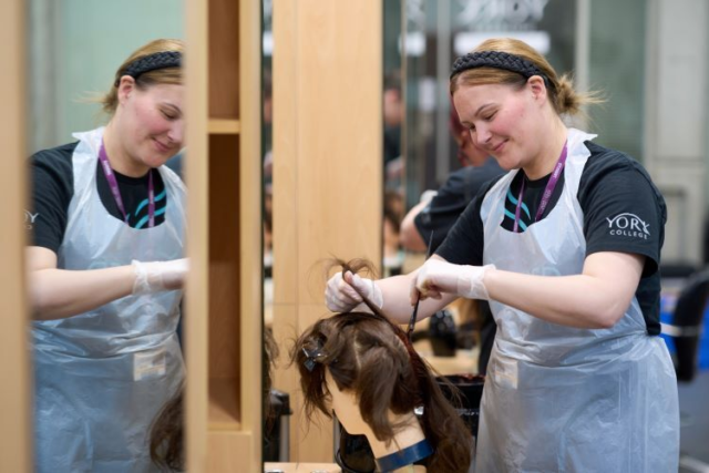 A student sections some hair