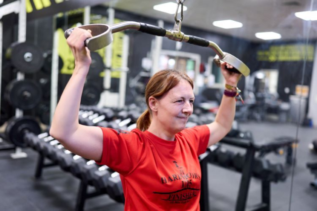 A student performs a lat pull down
