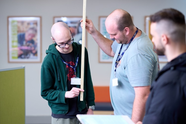 Access Health students perform a grip test