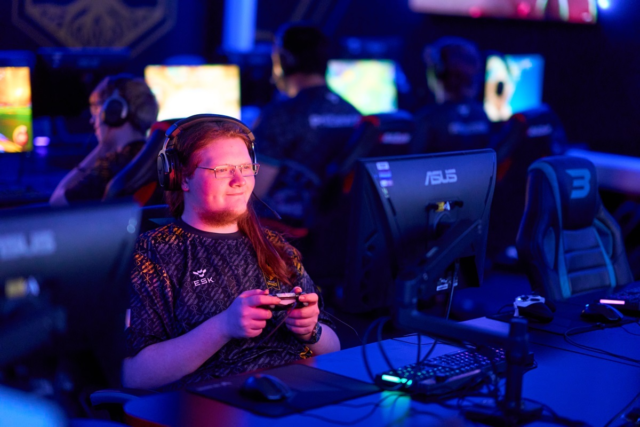 A student plays on a computer game Esports