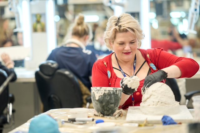 A student uses plaster to mould a mask Media Makeup