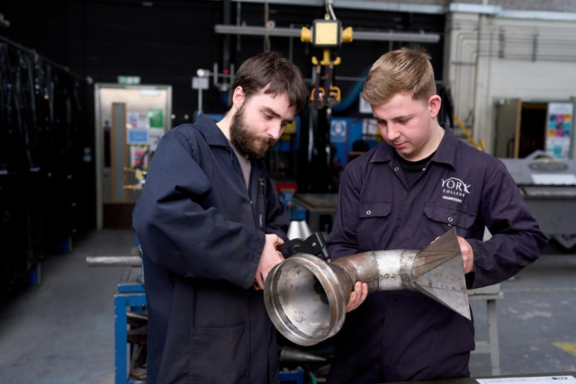 Two engineering students working together workshop