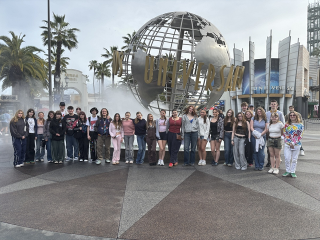 A Level Film Studies students stand outside the entrance to Universal Studios in America