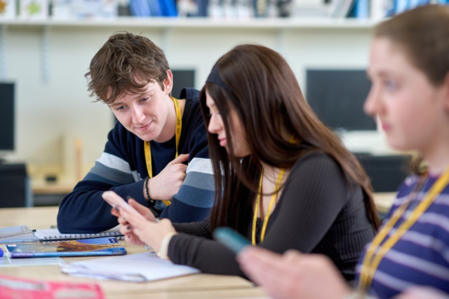 A Level French students are doing an interactive language quiz on their phones