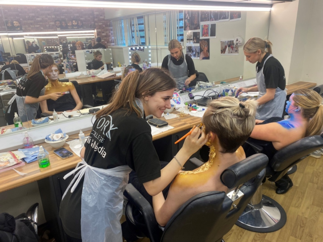 Hair Media Make up students working on models in the studio