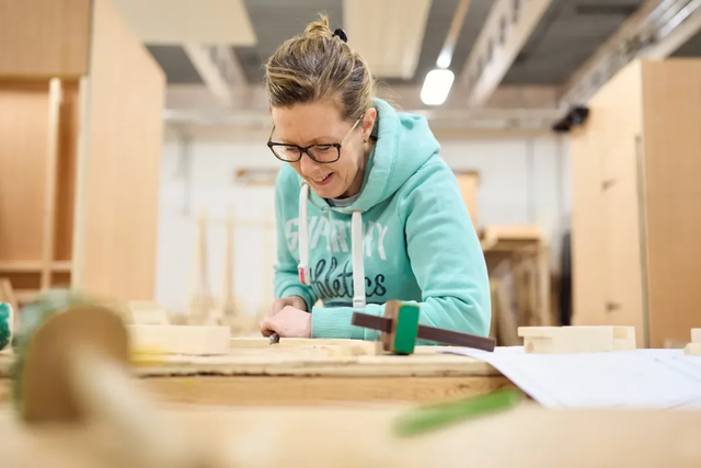 Adult furniture making student working in the workshop