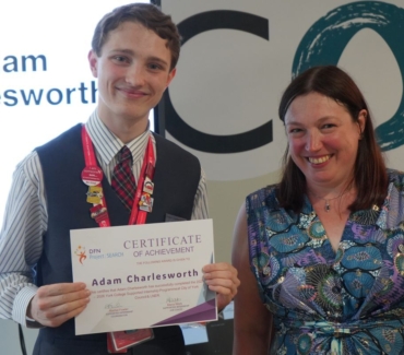 Adam Charlesworth receiving his Supported Internship certifcate from Rachel Fowler