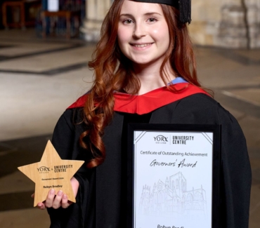 Robyn Bradley with her Graduation Governors star shaped award and certificate in York Minster